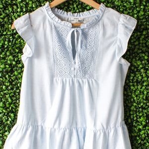 woven top, ruffle cap sleeves, tie neck ruffle hem